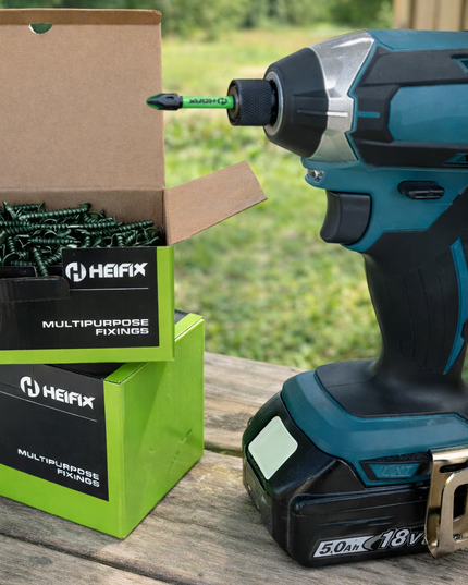 Power drill with Heifix boxes on a wooden surface